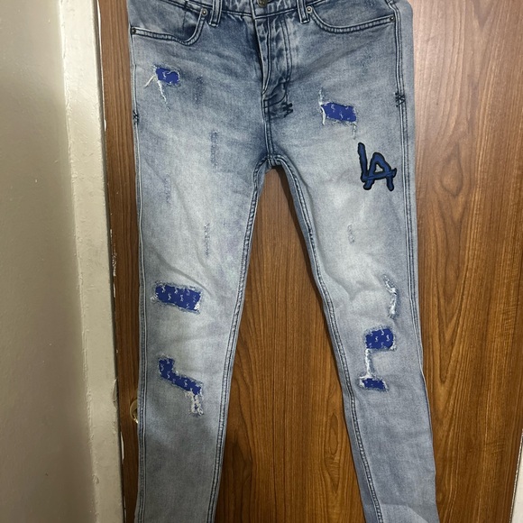 Ksubi Light Wash Jeans with Blue Distressed Details